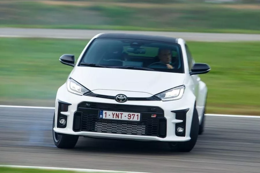 A picture of a Toyota GR Yaris sliding on a race track