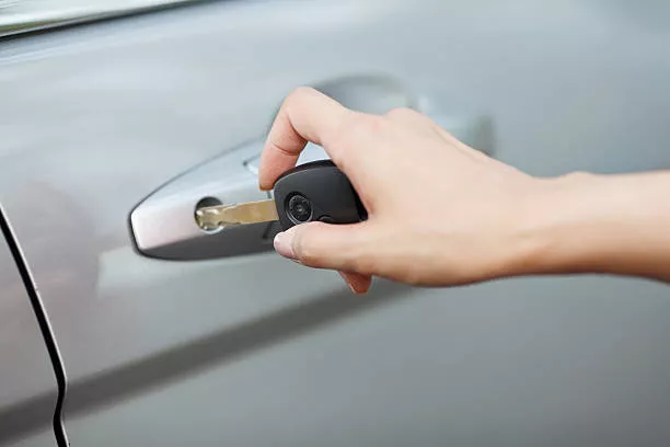 Opening car door with key