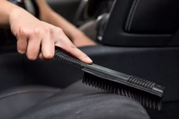 Brushing seats to clean them even more and reach some hidden areas inside the car brush the car seats