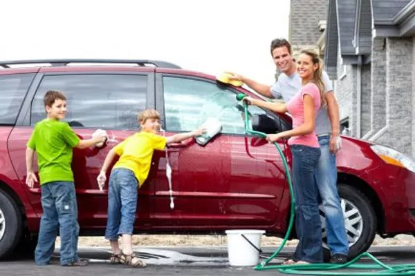family washing car