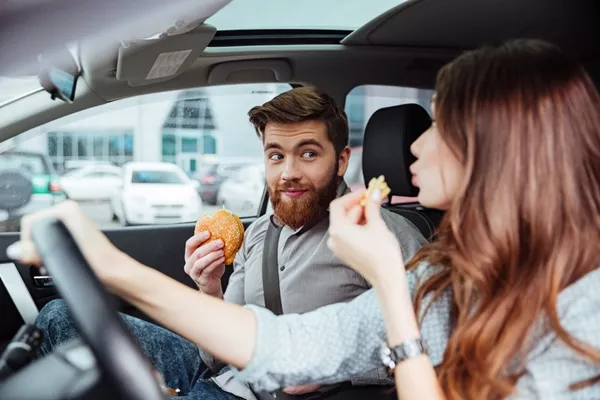 passenger and driver eating while driving