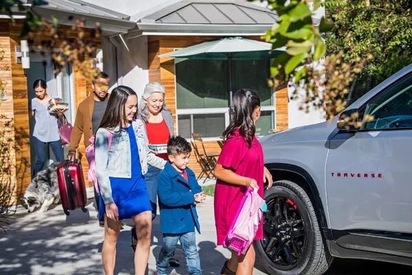 a family boarding an SUV