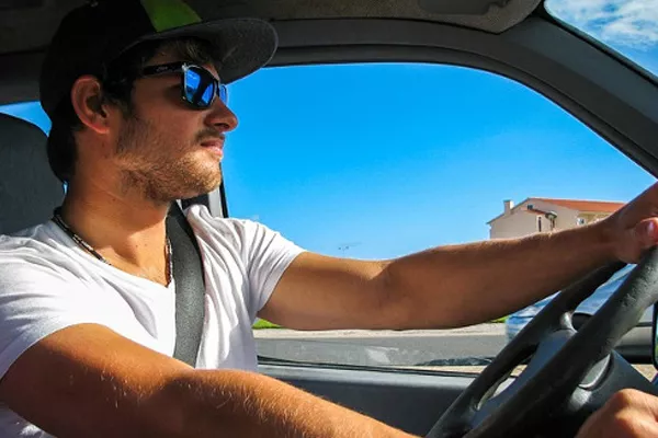A man driving a car