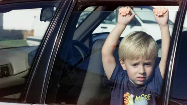 A kid in a car