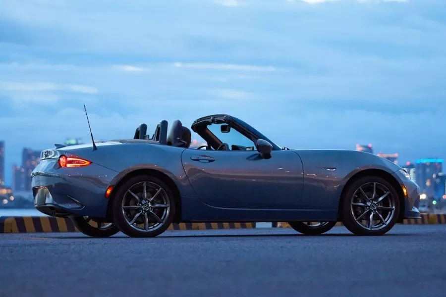 A sports car with a renowned history in the industry Mazda MX-5 side view