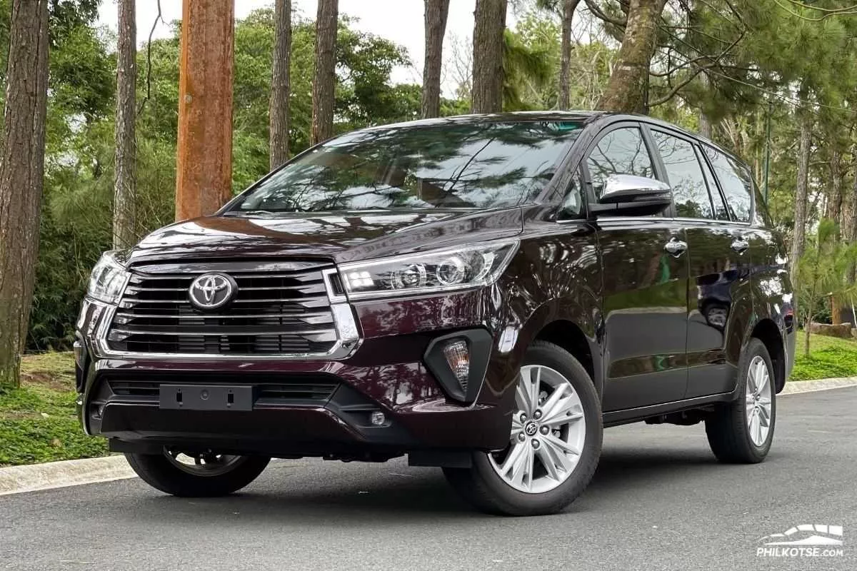 A picture of the Toyota Innova on a quiet, wooded road