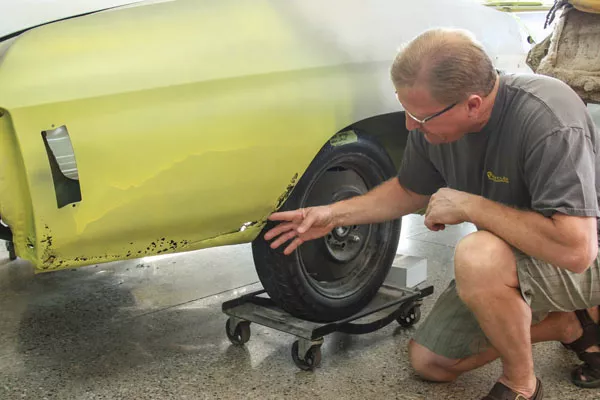 checking a rusted car