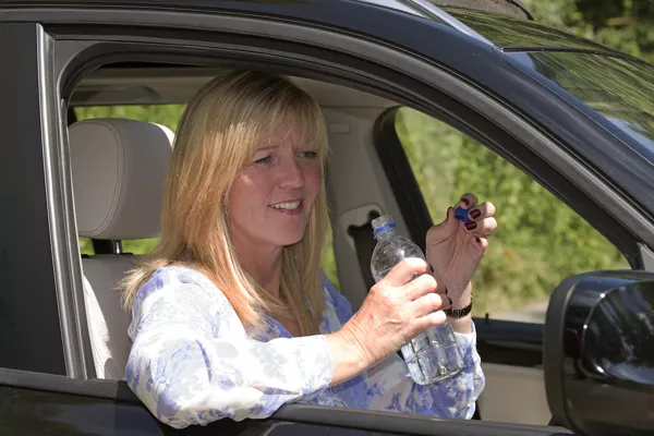 Drinking water in a car