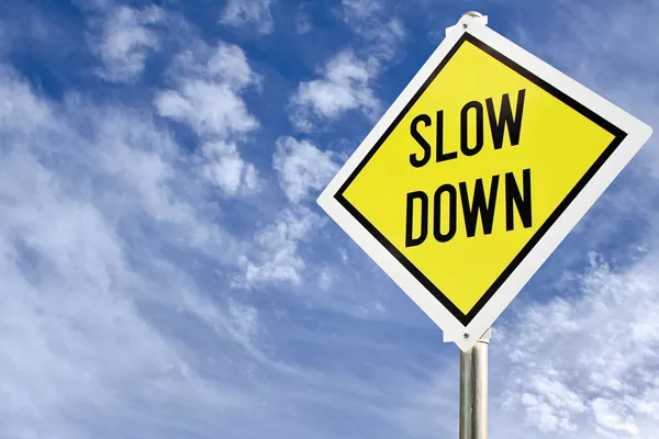 Slow down sign
