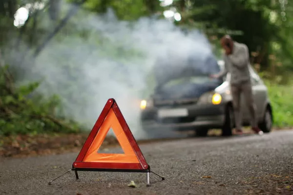 Let other people know that there's a road accident ahead by putting early warning devices warning sign