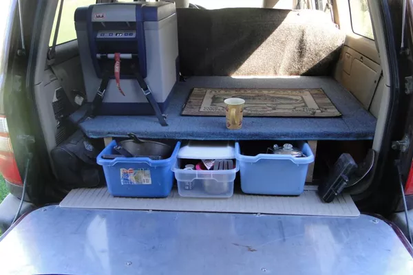 Organize a car by using boxes and baskets