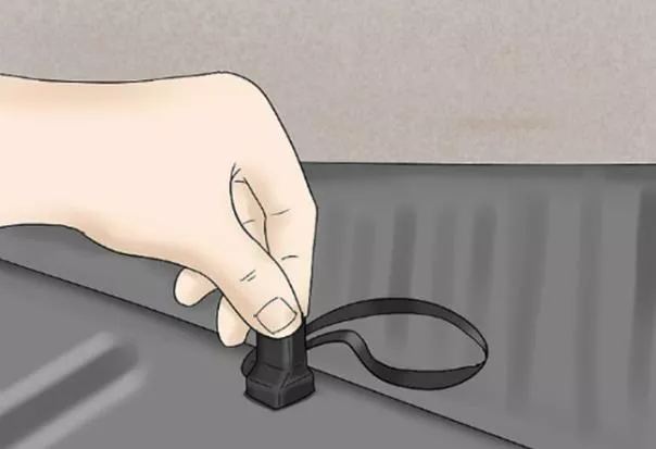 After having located the end of the cord, pull on it to unlock the back seats and make them fall forward emergency trunk cord