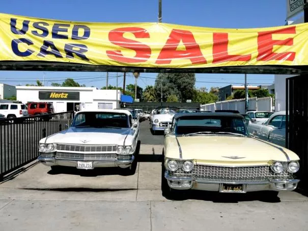 two used cars parking in parallel