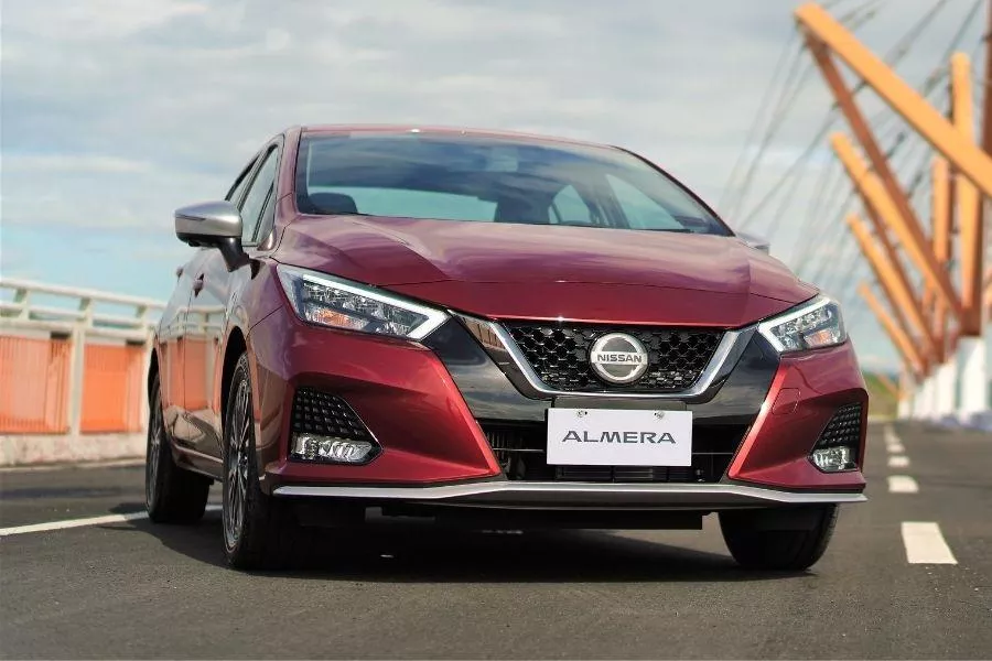 A picture of the new Almera parked in the middle of a road