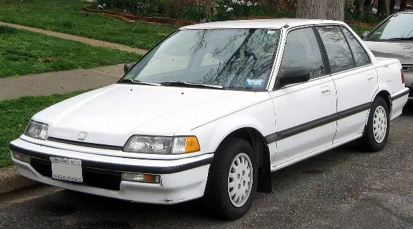 A white Honda Civic on the road