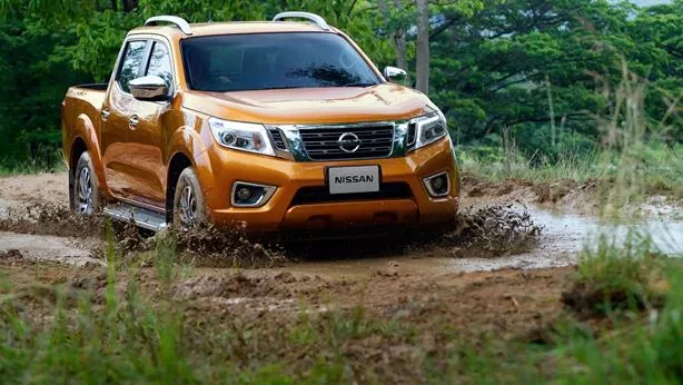 A orange Nissan Navara angular front view