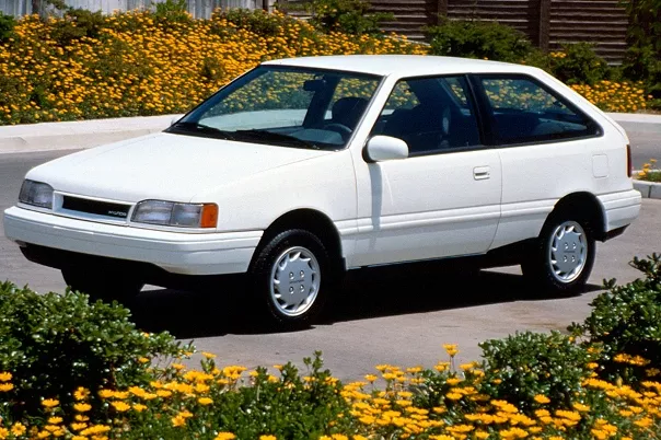 A white Hyundai Accent angular front view