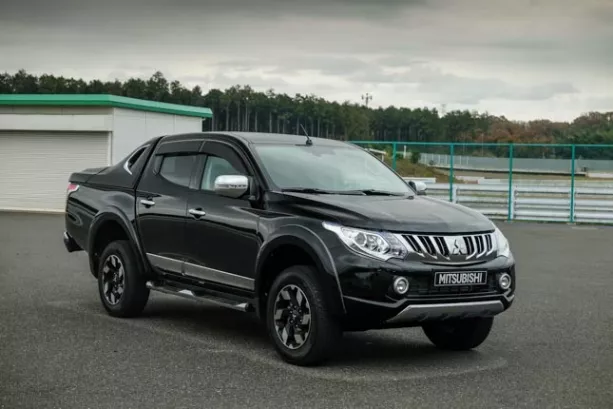 A black Mitsubishi Strada angular front view
