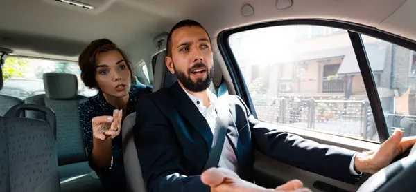 woman telling man how to drive