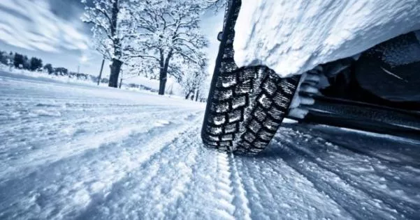 Car tire on a snowy road