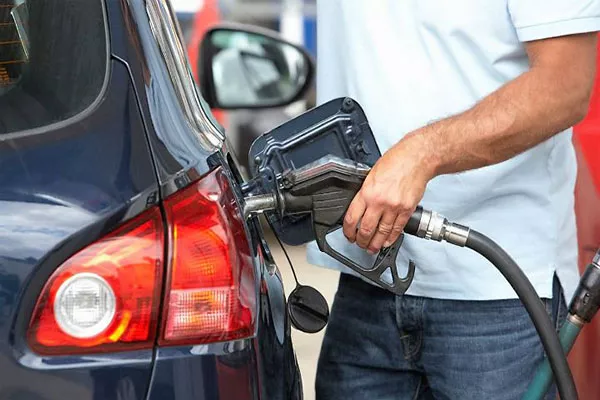 filling car tank at fuel station