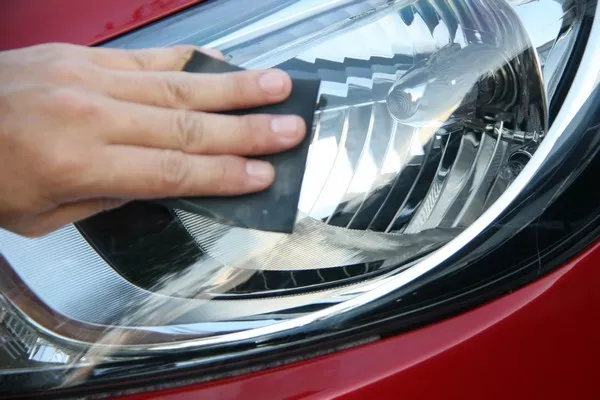 Cleaning a headlight