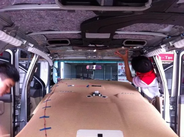 Interior insulation being installed inside a car