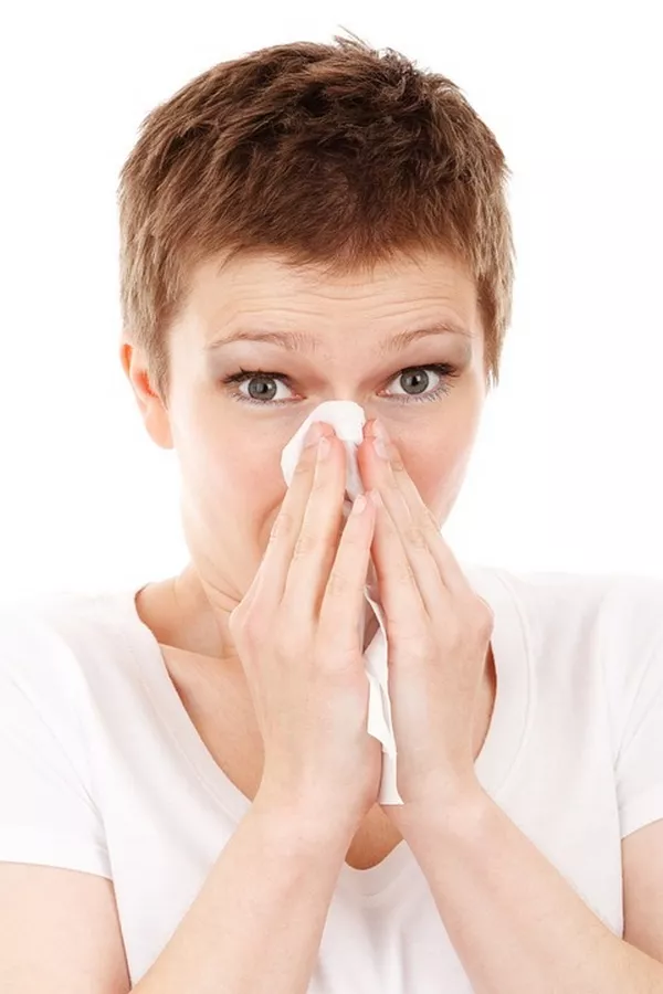 a woman suffering from allergies