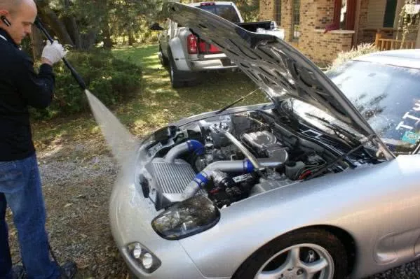 Washing car engine using high-pressure nozzle