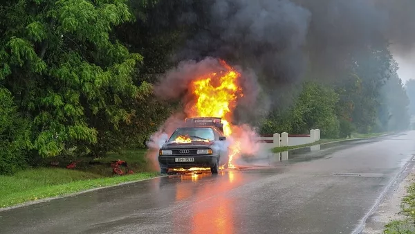 a car on fire on the road
