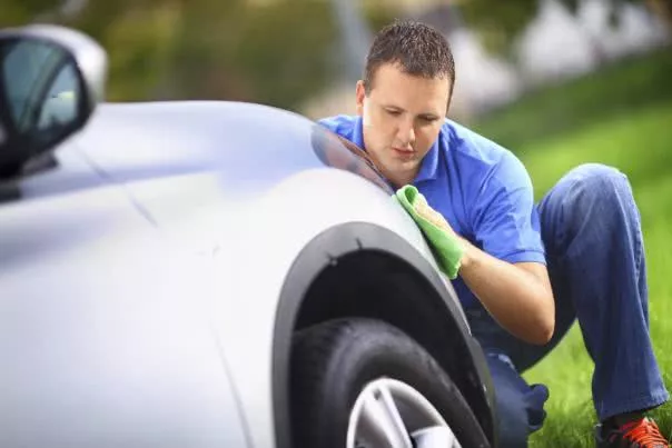 Potential customers do balk at anything that might suggest less-than-budget-friendly maintenance A man is cleaning his car
