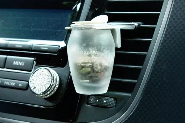 A car freshener attached to the air vent
