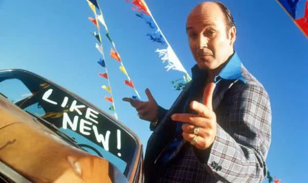 A man is showing a like-new car