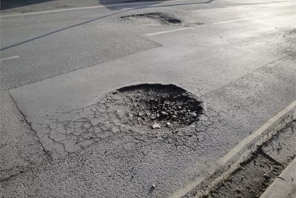 huge pothole on the road