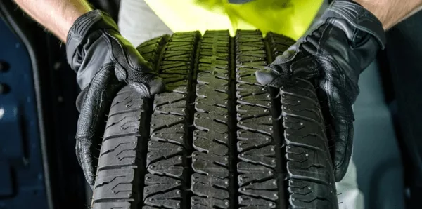 checking tread wear on car tire