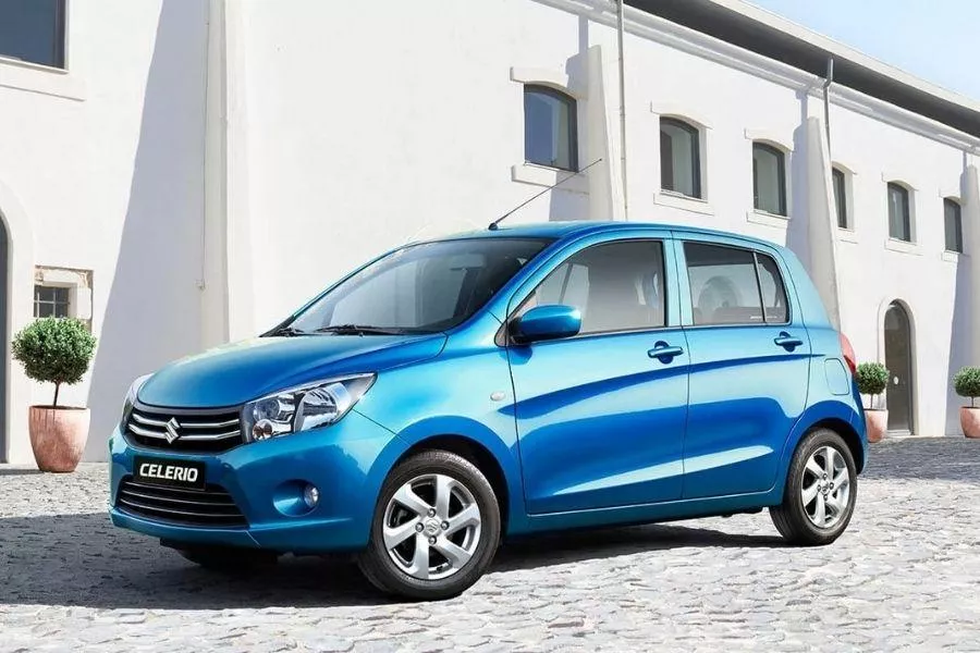 A picture of a Suzuki Celerio parked near a house