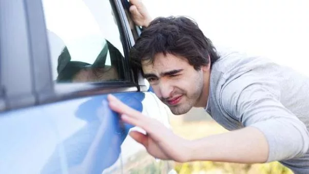 A men checking a car