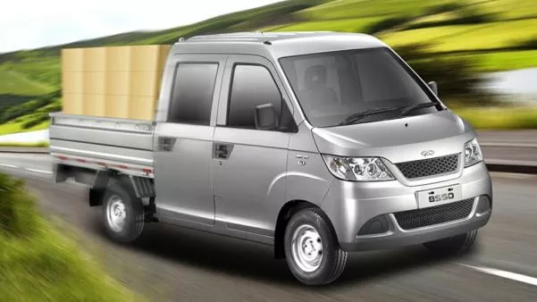 The Q22B can convert its roomy cargo bed into a drop-side pick-up a Chery Q22B on the road