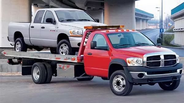The best option for towing all-wheel drive vehicles would be a flat-bed truck, where the vehicle can be placed on top and secured for safe transport flatbed truck carrying a pickup truck on top
