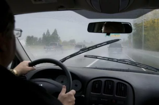 a driver driving a car in storm