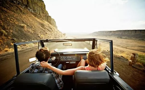 Don't leave home without our tried and tested driving tips. A couple driving on a road