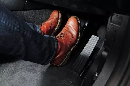 Squeeze the brake pedal firmly