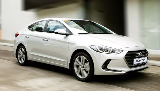 A white Hyundai Elantra on the road