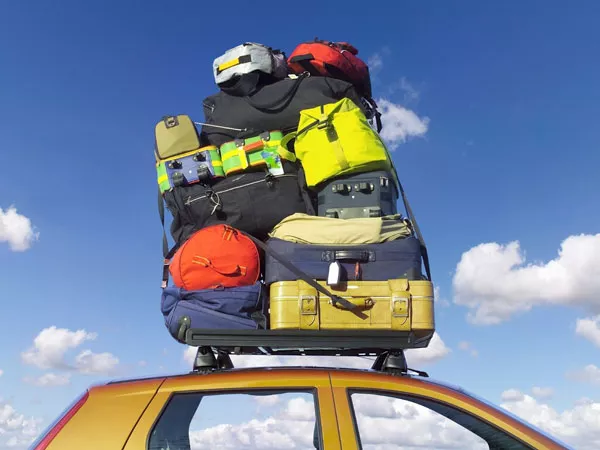 Additional luggage placed on the top of the car should be protected from rain and dirt luggage placed on the top of the car