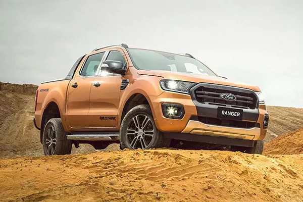 A picture of the Ranger Wildtrak on top of a mount of dirt