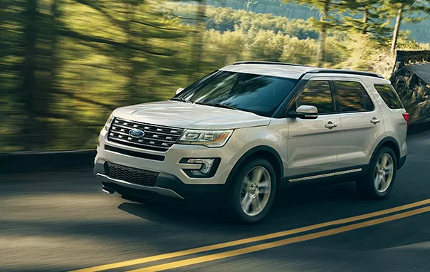 A white SUV on the road