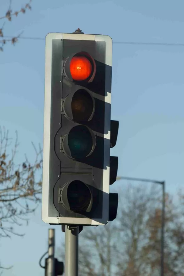 The light will turn from red to green just in time, and you will still have enough momentum to accelerate the car without using too much fuel red light