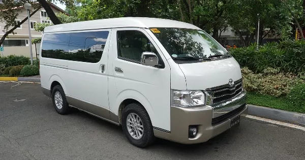 A White Toyota HiAce Super Grandia angular front view