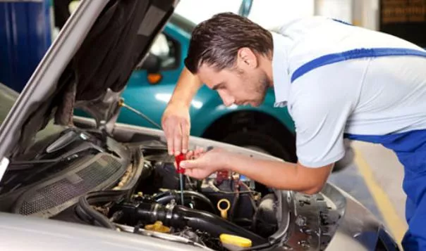 A man repairing car engine