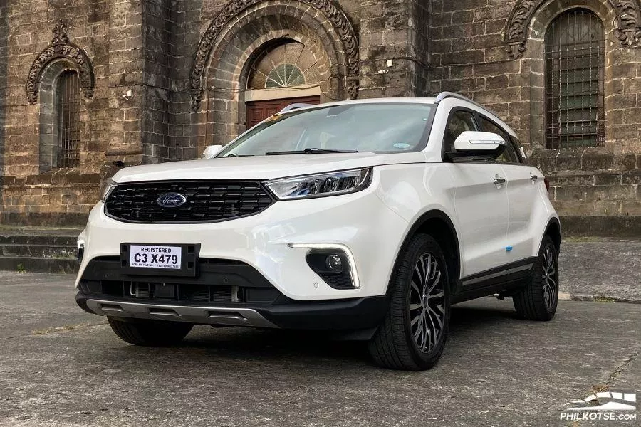 A picture of the Ford Territory parked near an old church.